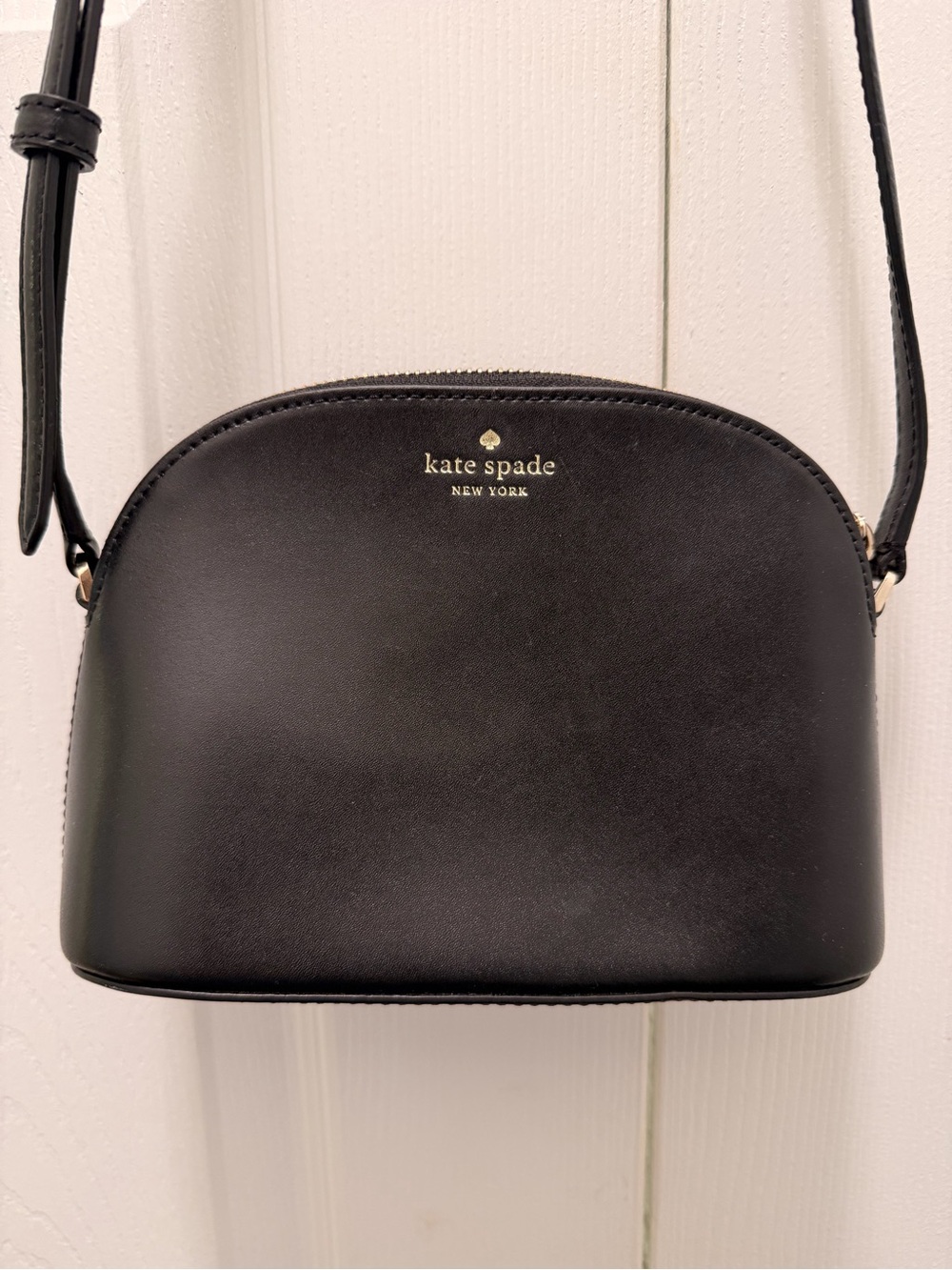 kate spade black leather dome crossbody with gold logo
